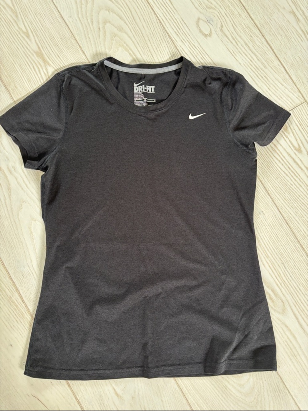 Women’s Nike size medium dri-fit tee.